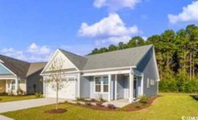 View of front of house with covered porch, concrete driveway, a front lawn, and a garage