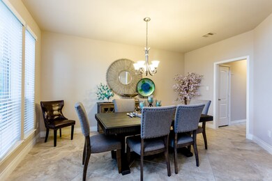 Elegant dining area with a convenient walk way to the kitchen and pantry.