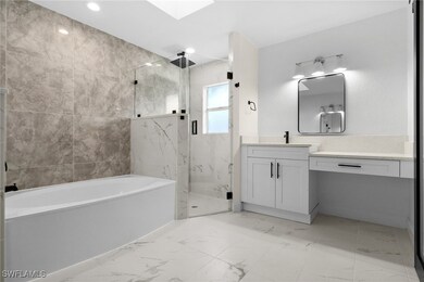 Bathroom featuring vanity and plus walk in shower