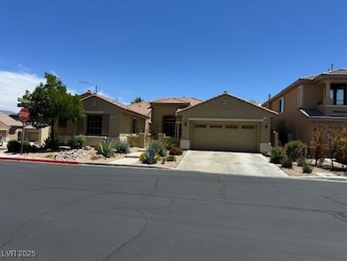 View of front of home with an attached garage, stu