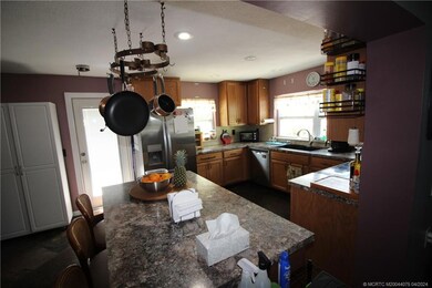 A kitchen island provides storage and informal din