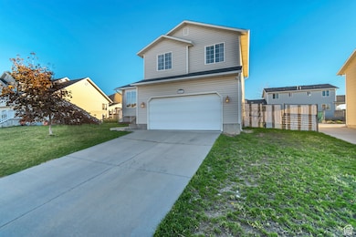 Traditional-style home with driveway and an attached garage