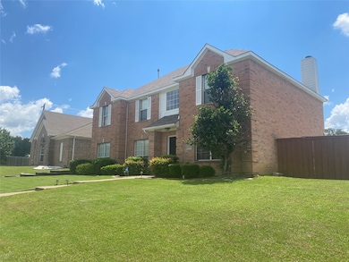 Traditional-style house featuring brick siding and a chimney