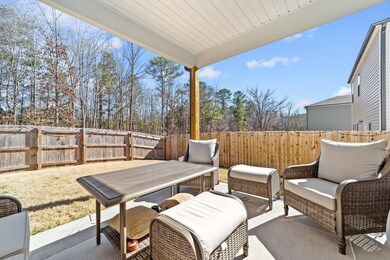 Overlooking fenced back yard.