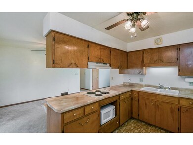 Additional view of kitchen with cooktop surface