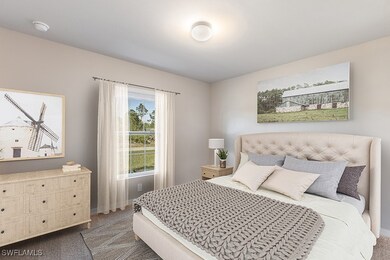 Bedroom with carpet floors and baseboards