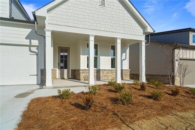 Entrance to property with a garage and covered por