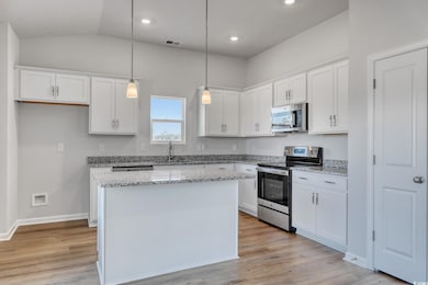 Kitchen featuring stainless steel appliances, a ce