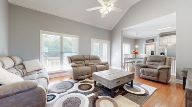 Great Room- Features vaulted ceilings & recessed lighting.