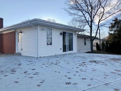 Large rear concrete patio with new sliding door- o
