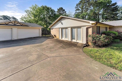 Exterior space with brick siding, an outbuilding, 