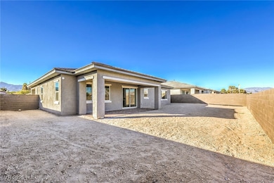 Rear view of house featuring a fenced backyard, a