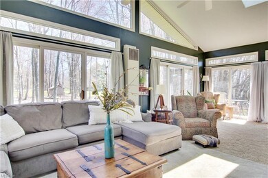 Sun room to enjoy your large private lot all year-