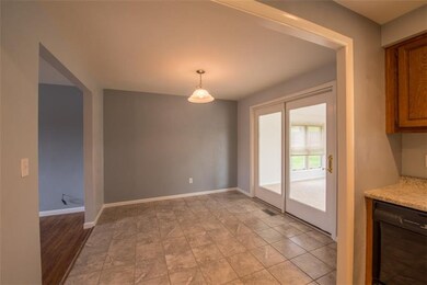 Freshly painted and new tile flooring leads out to