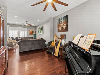 Living room featuring dark wood-type flooring, cei