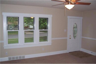 Exterior Front. Front room.  Newer windows and doo