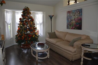 FORMAL LIVING ROOM WITH LARGE BAY WINDOW