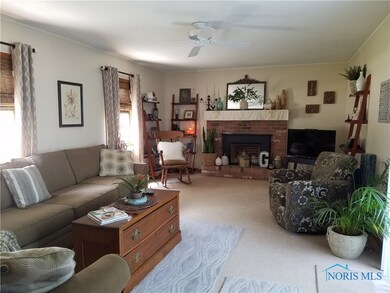 Bright and spacious Family Room with beautiful brick gas fireplace.
Sliding glass doors lead to deck overlooking backyard oasis.