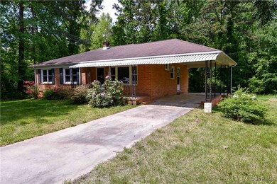 Ranch-style house with concrete driveway, an attac
