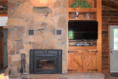 Amazing stone fire place with built in wood burner