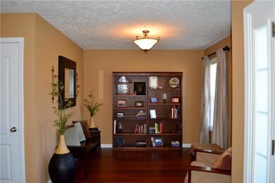 Formal living room is just off the entry way. This space would make a nice office too!