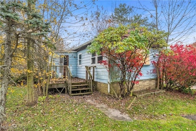 View of property exterior with a deck