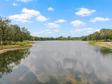 Water view featuring a heavily wooded area