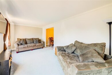 Living room w/crown molding and accent wall painte