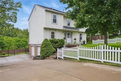 WHITE PICKET FENCE AND LARGE DRIVEWAY