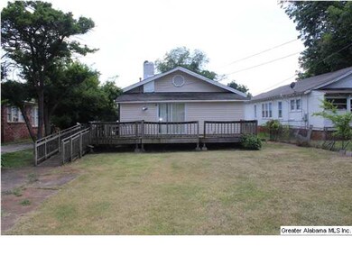 View of back of house with open deck