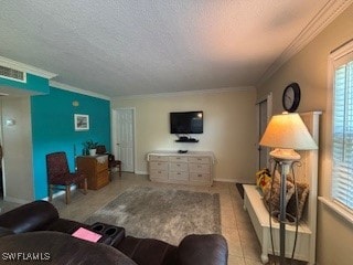 Living room featuring baseboards, crown molding, a
