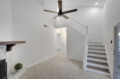 Unfurnished living room with a high ceiling, a cei