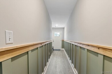 The aesthetic of the hallway is both rustic and ch