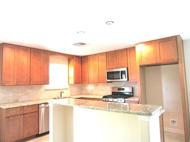 Enjoy Your Gourmet Kitchen with a Breakfast Bar.