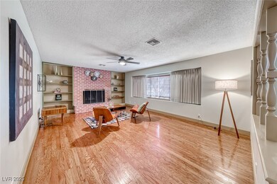 Large living room with wood burning fireplace (can