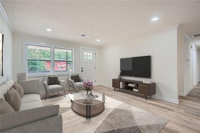 Living room featuring crown molding, visible vents