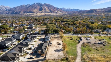 Aerial overview of property's location with mountains and nearby suburban area