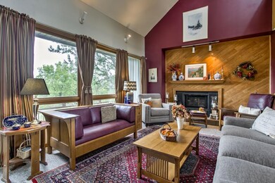 Living room with fireplace and great views!