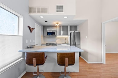 Kitchen featuring stainless steel appliances, a k