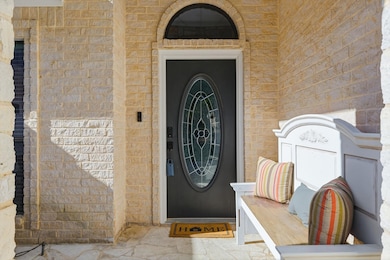 Entrance to property featuring brick siding