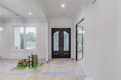 Entrance foyer featuring french doors, recessed li