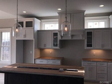Kitchen with custom cabinetry, granite countertops