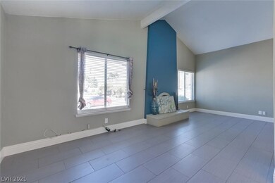 fireplace and front large windows with windowtreat