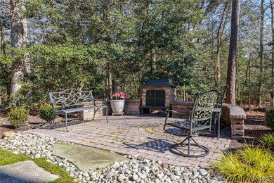 Lovely hardscaped patio with wood burning fireplac