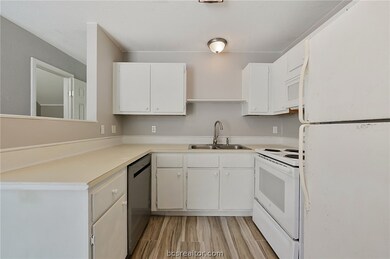 Kitchen has recent paint, updated tile flooring, n
