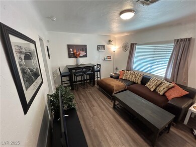 Living area featuring wood finished floors