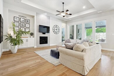 Living room with light hardwood flooring a tile fi