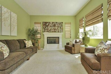 LIVING ROOM WITH COZY FIREPLACE