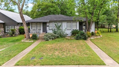 View of front of house with covered porch and a f