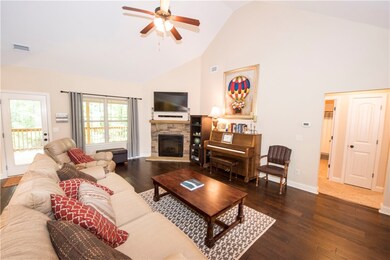 Great Room with vaulted ceiling, gas logs fireplac